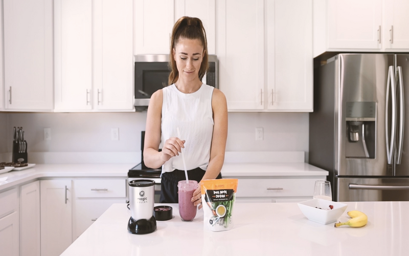 woman drinking bone broth with her morning smoothie